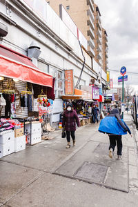 People walking on street in city