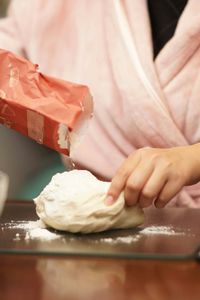 Midsection of woman preparing food