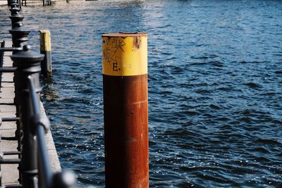 Close-up of metal poles in water