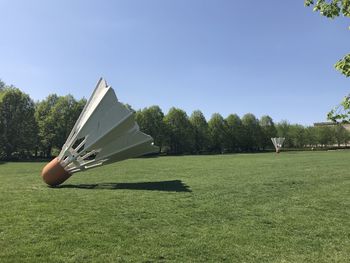 Trees on field against clear sky