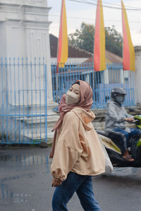 Rear view of woman with umbrella