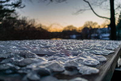 Surface level of stones in city against sky
