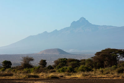 Scenic view of mountains against clear blue sky