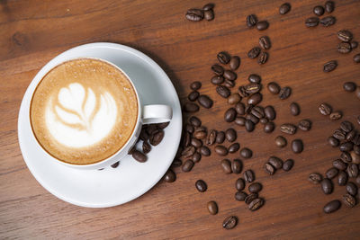 High angle view of coffee cup on table