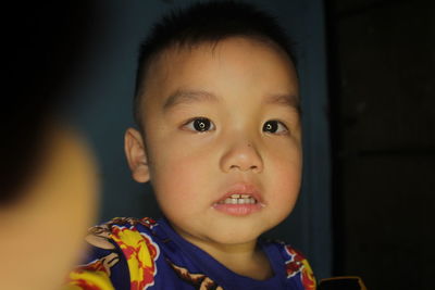 Close-up portrait of cute baby at home