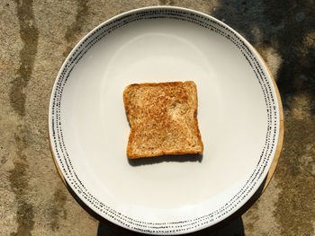 Close-up high angle view of bread in plate