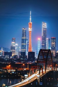 Illuminated buildings in city at night