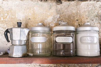 Containers on shelf