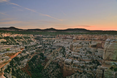 Scenic view of landscape against sky during sunset