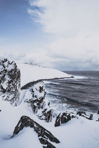 Scenic view of sea against sky during winter