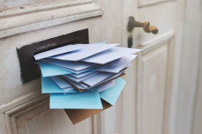 Close-up of paper hanging on wall