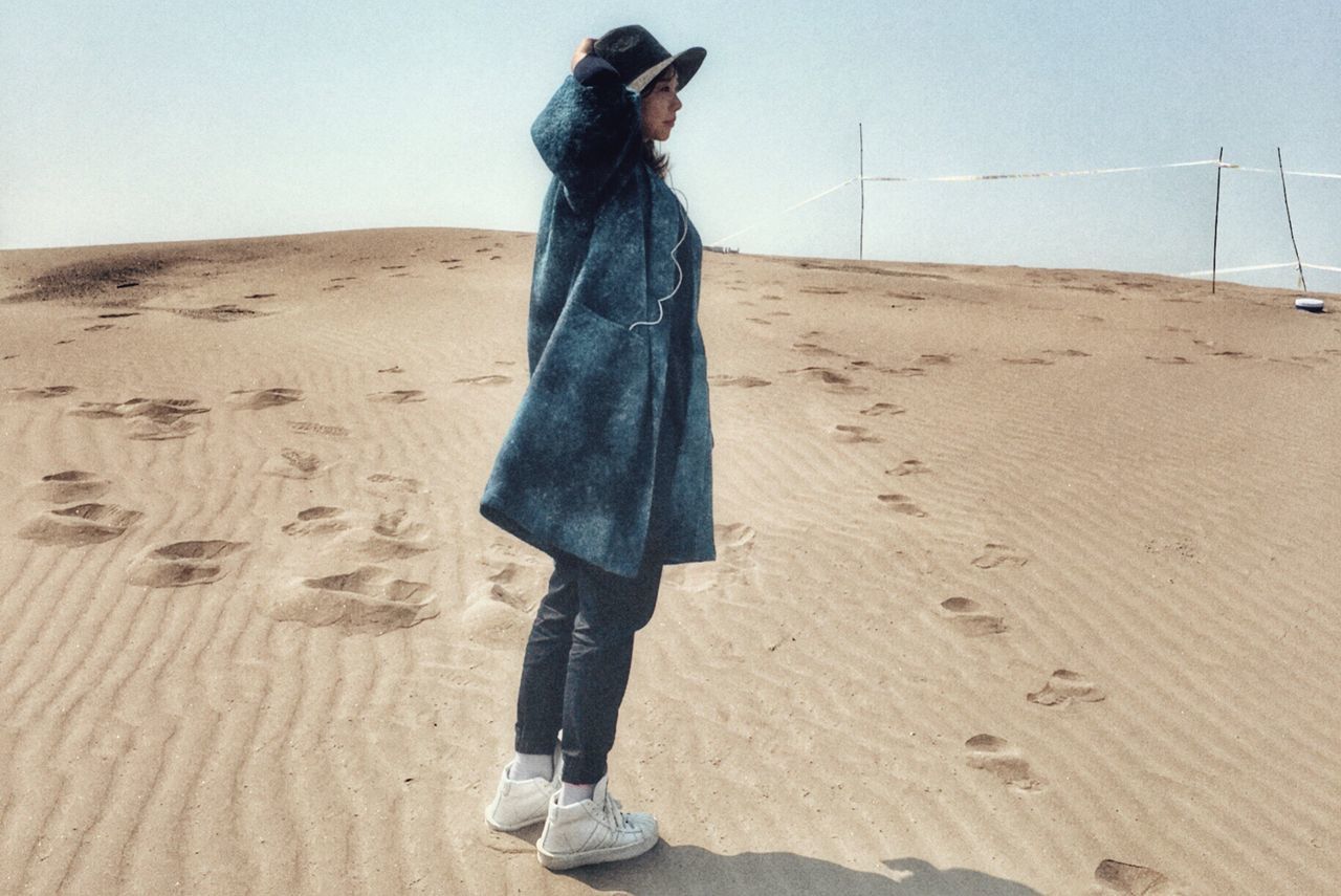 sand, desert, one woman only, only women, one person, sand dune, adults only, one young woman only, young adult, beach, vacations, people, outdoors, adult, sunset, women, sky, day