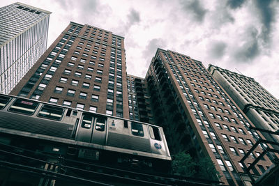 Low angle view of skyscrapers against sky