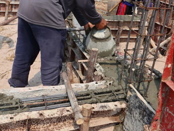 Low section of man working at construction site