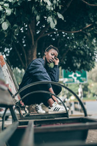 Young woman sitting in car