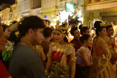 Group of people in market stall