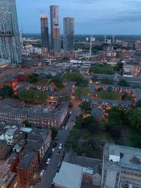 High angle view of buildings in city against sky