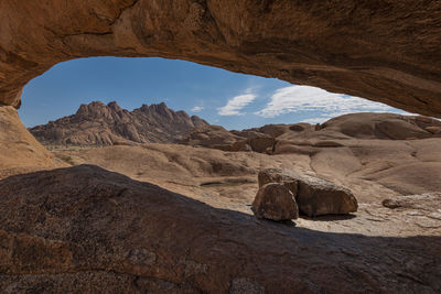 Rock formation in desert against sky