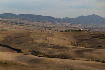 Scenic view of landscape and mountains against sky