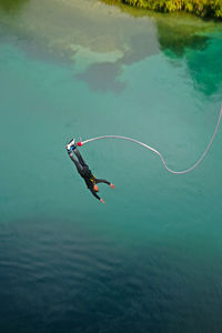 High angle view of man swimming in sea