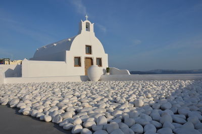 View of white building against blue sky