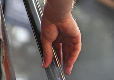 Close-up of hands holding glass