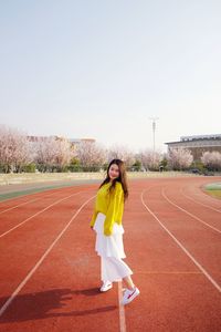 Full length portrait of young woman