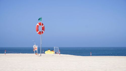 Scenic view of beach against clear sky