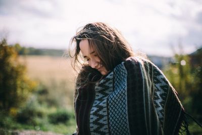 Young woman looking away outdoors