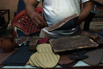 Midsection of man preparing food