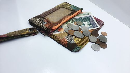 High angle view of coins on table