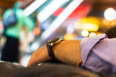 Cropped hand of man with wristwatch