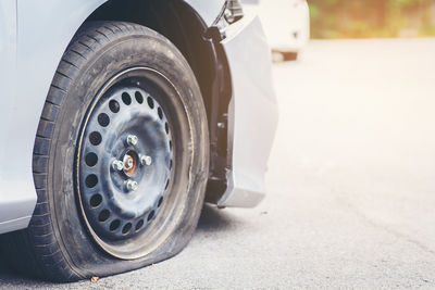 Punctured car on road