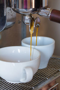 Preparing two espressos in a professional coffee machine