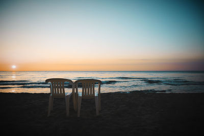 Scenic view of sea against clear sky during sunset