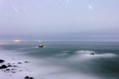 Scenic view of sea against sky during rainy season