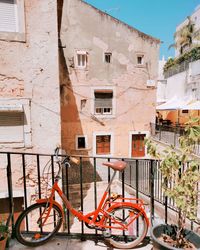 Bicycle by residential buildings in town