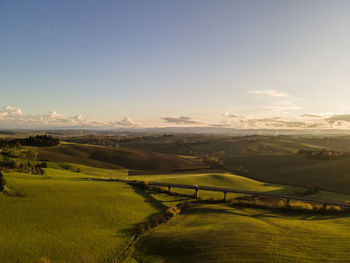 Scenic view of agricultural landscape against sky