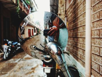 Close-up of motorcycle on wall in building