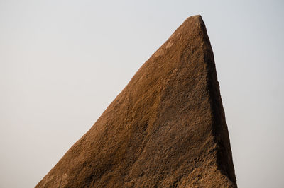 Low angle view of desert against clear sky