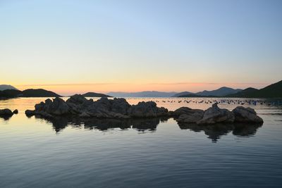 Scenic view of sea at sunset