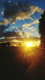 Scenic view of sunset over silhouette landscape