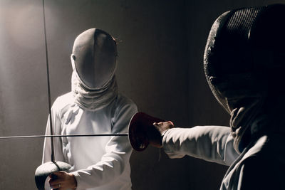 Women practicing fencing