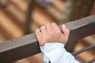 Close-up of hands holding wood