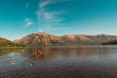 Scenic view of lake against blue sky