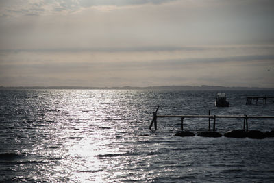 Scenic view of sea against cloudy sky