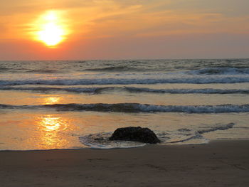 Scenic view of sea at sunset