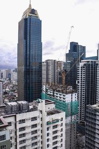 Modern buildings in city against sky