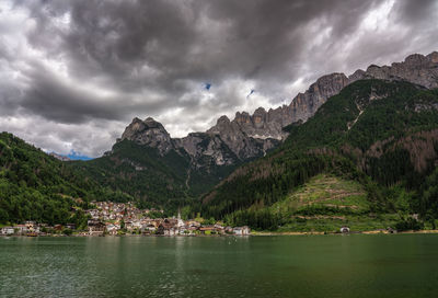 Scenic view of lake and mountains against sky