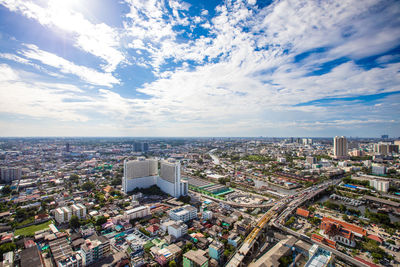 High angle view of modern buildings in city against sky